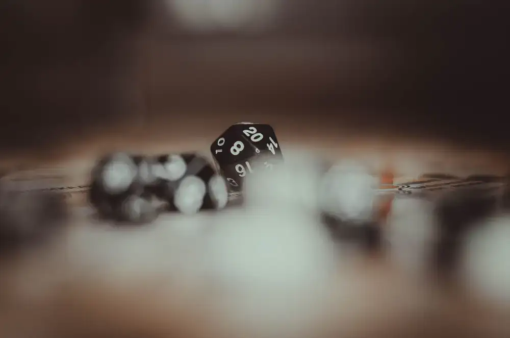 Friends laughing around a game table rolling dice